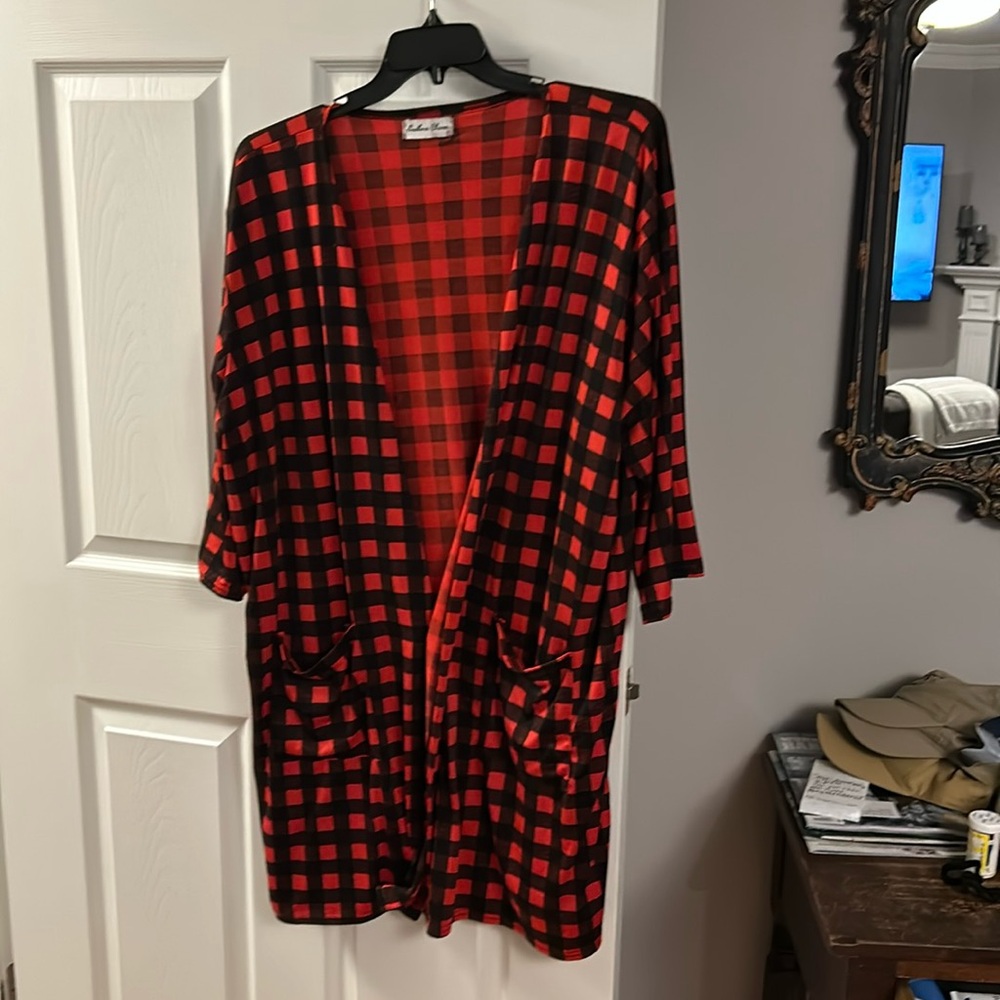 Nylon and spandex jacket. Size  P like a 2x
Red and black check. 2 pockets